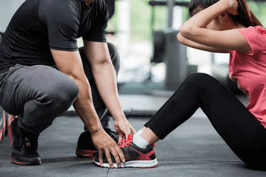 The Liberty Gym offers personal training such as these sit-ups